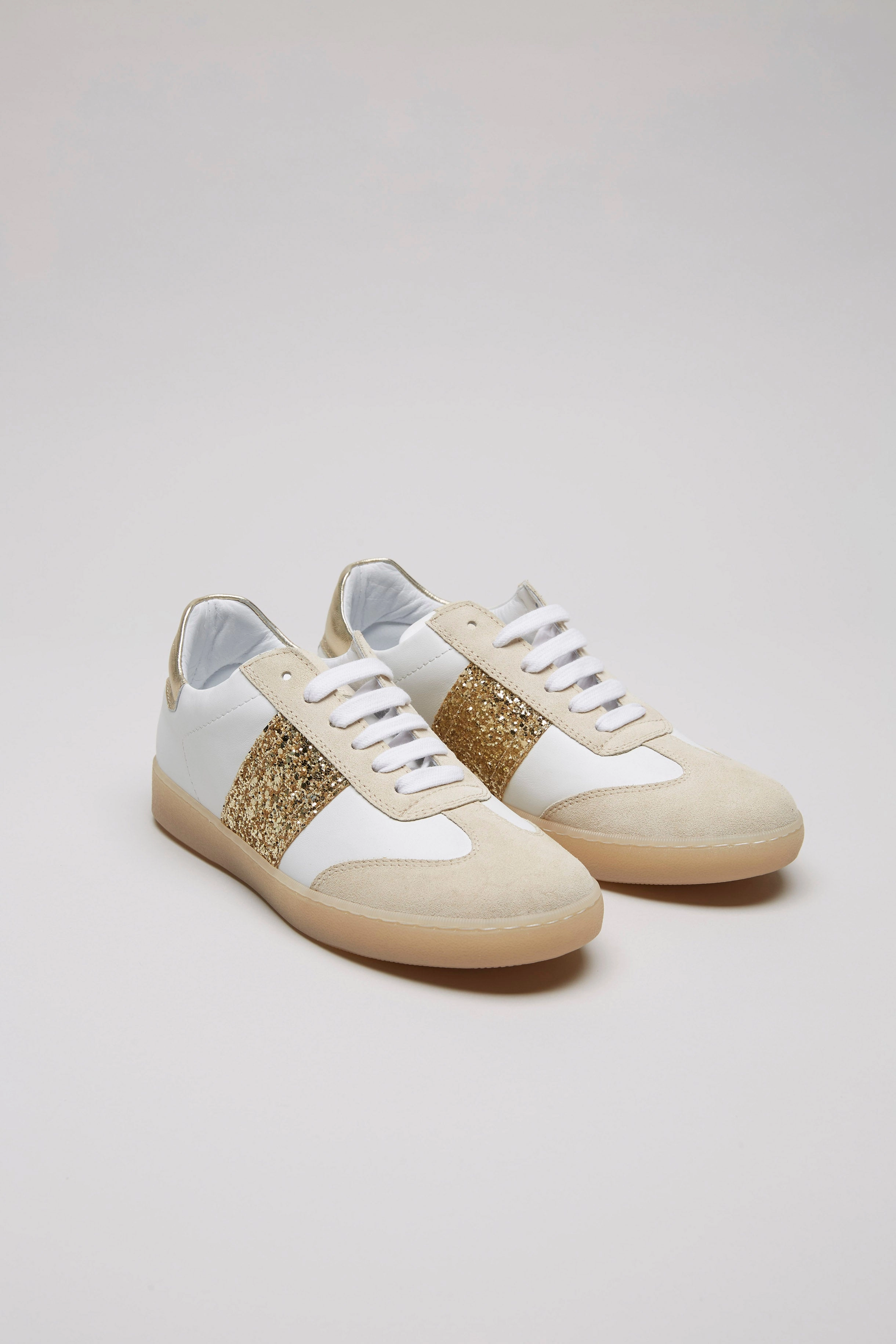 INIKI Sneaker gold Sneaker Schwarz Weiße Sohle